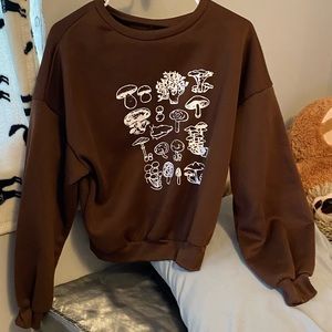brown long sleeve with mushrooms, very soft and comfortable, size medium